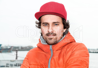 Portrait of a young successful man on the background sea landsca