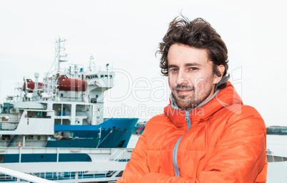 Portrait of a young successful man on the background sea landsca