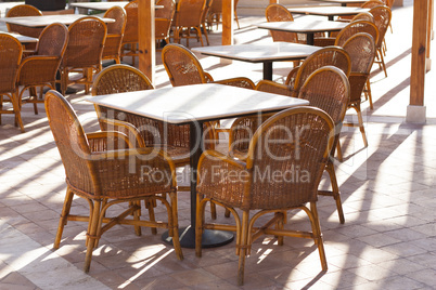 Wooden tables in a outdoor restaurant photo