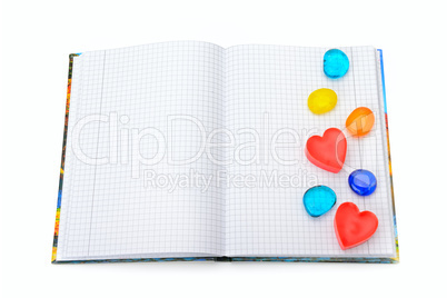 notebook with the decoration in the form of hearts isolated on w