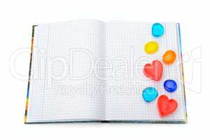 notebook with the decoration in the form of hearts isolated on w
