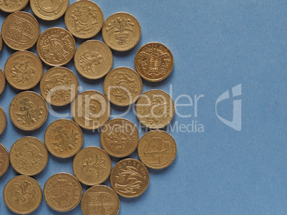 Pound coins, United Kingdom over blue with copy space