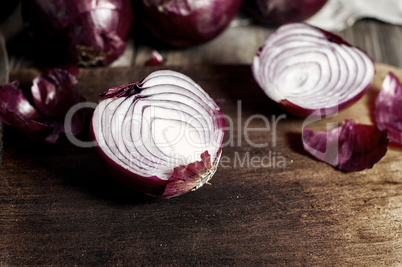 Red onions in the husk cut in half