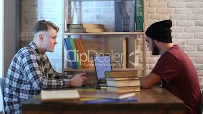 Hipster students studying in library at university