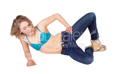 Woman in bra lying on floor.