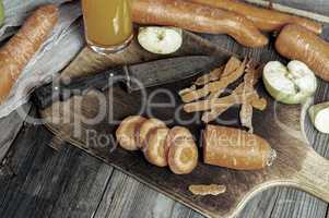 glass of carrot apple juice, close-cut pieces of vegetables