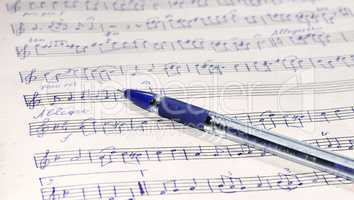 Music sheet and pen