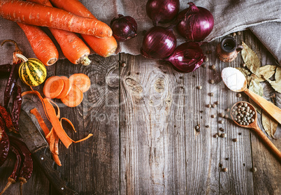 Fresh  vegetables and spices on gray wooden surface