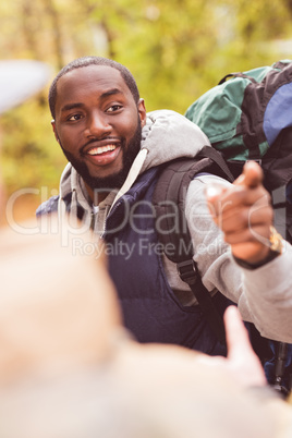 Young smiling man backpacker