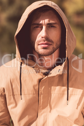 Handsome man in jacket with hood