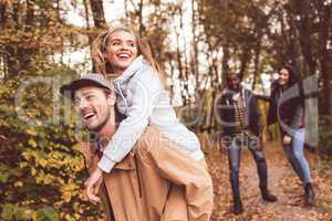 Happy friends having fun in forest