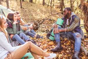 Young friends travelers in forest