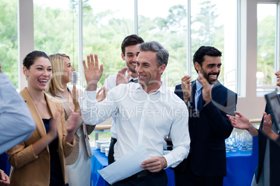 Happy business executives giving high five