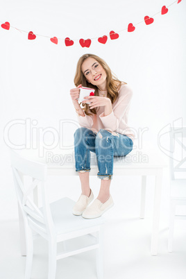 Woman holding cup
