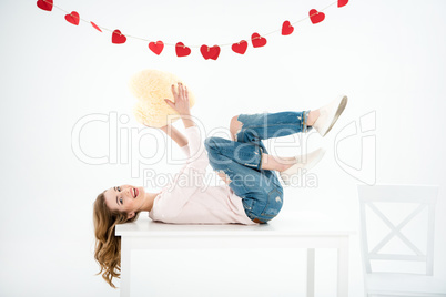 Woman with heart shaped pillow