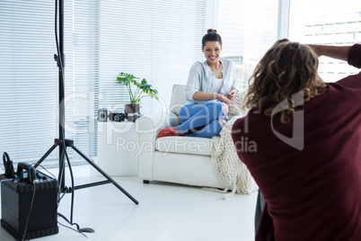 Female model posing for photographer