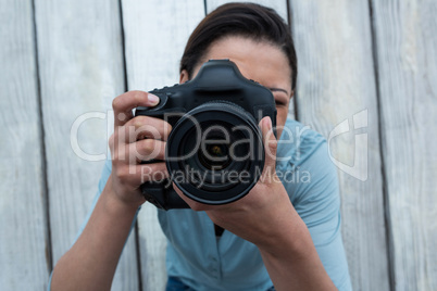 Female photographer with digital camera