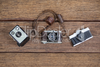 Close-up of old fashioned cameras on table