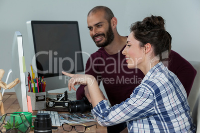 Photographers working at desk