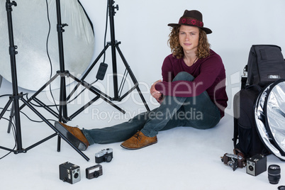 Photographer sitting in the photo studio
