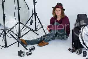 Photographer sitting in the photo studio
