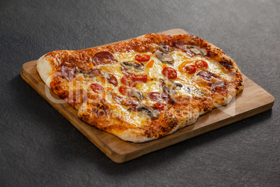 Delicious italian pizza served on wooden board