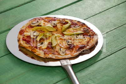 Delicious italian pizza served on pizza peel