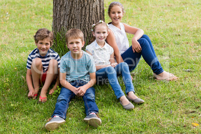 Smiling kids relaxing in park