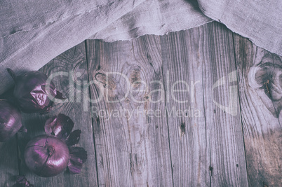 Vintage gray wooden background with red onion