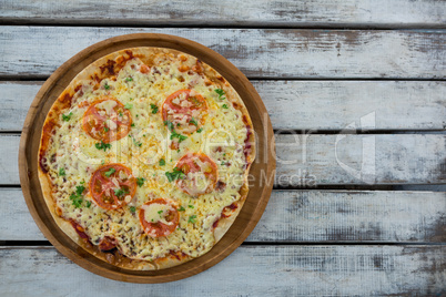 Italian pizza served on a wooden plank