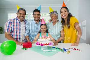 Happy multigeneration family celebrating birthday party at home