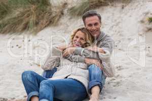 Mature couple embracing each other on the beach