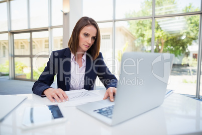 Businesswoman using laptop