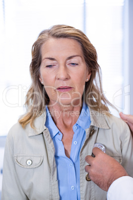 Doctor examining a senior woman