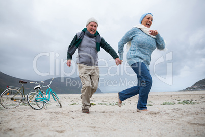 Senior couple having fun together at beach