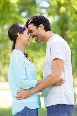 Couple embracing each other in park