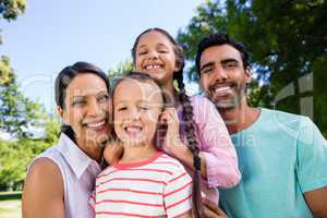 Portrait of happy family in park