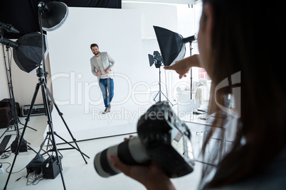 Male model posing for photographer