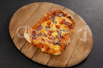 Delicious italian pizza served on wooden board