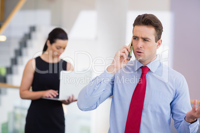 Businessman talking on mobile phone