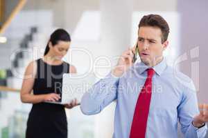 Businessman talking on mobile phone