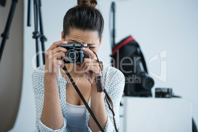 Female photographer with old fashioned camera