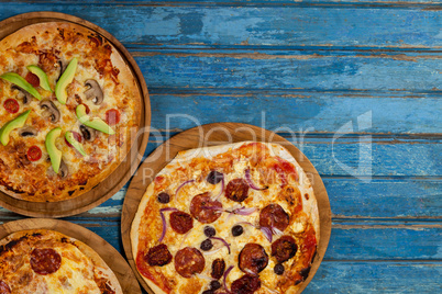 Various delicious italian pizza served on pizza tray