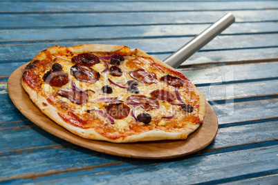 Delicious italian pizza served on pizza peel