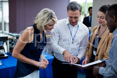 Business executives interacting with each other during break