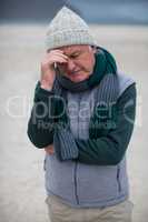 Senior man standing on the beach