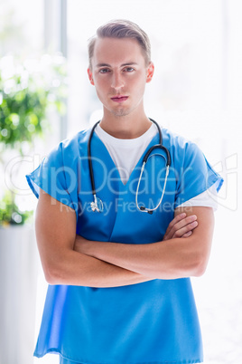 Portrait of doctor standing with arms crossed