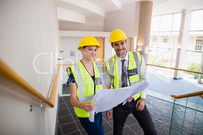 Architects holding a blueprint