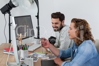 Photographers working together at the desk