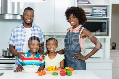 Parents and Kids standing in kitchen at home